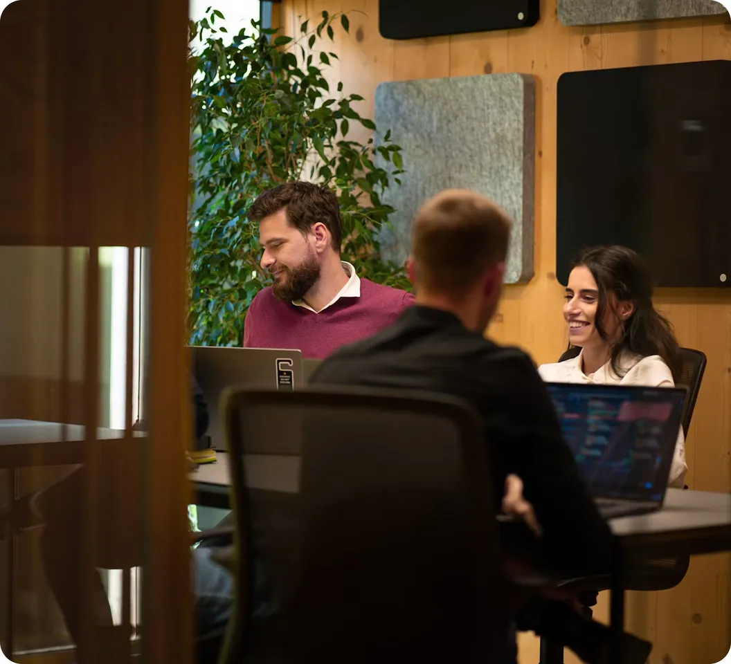 Intuitech team collaborating in the office.